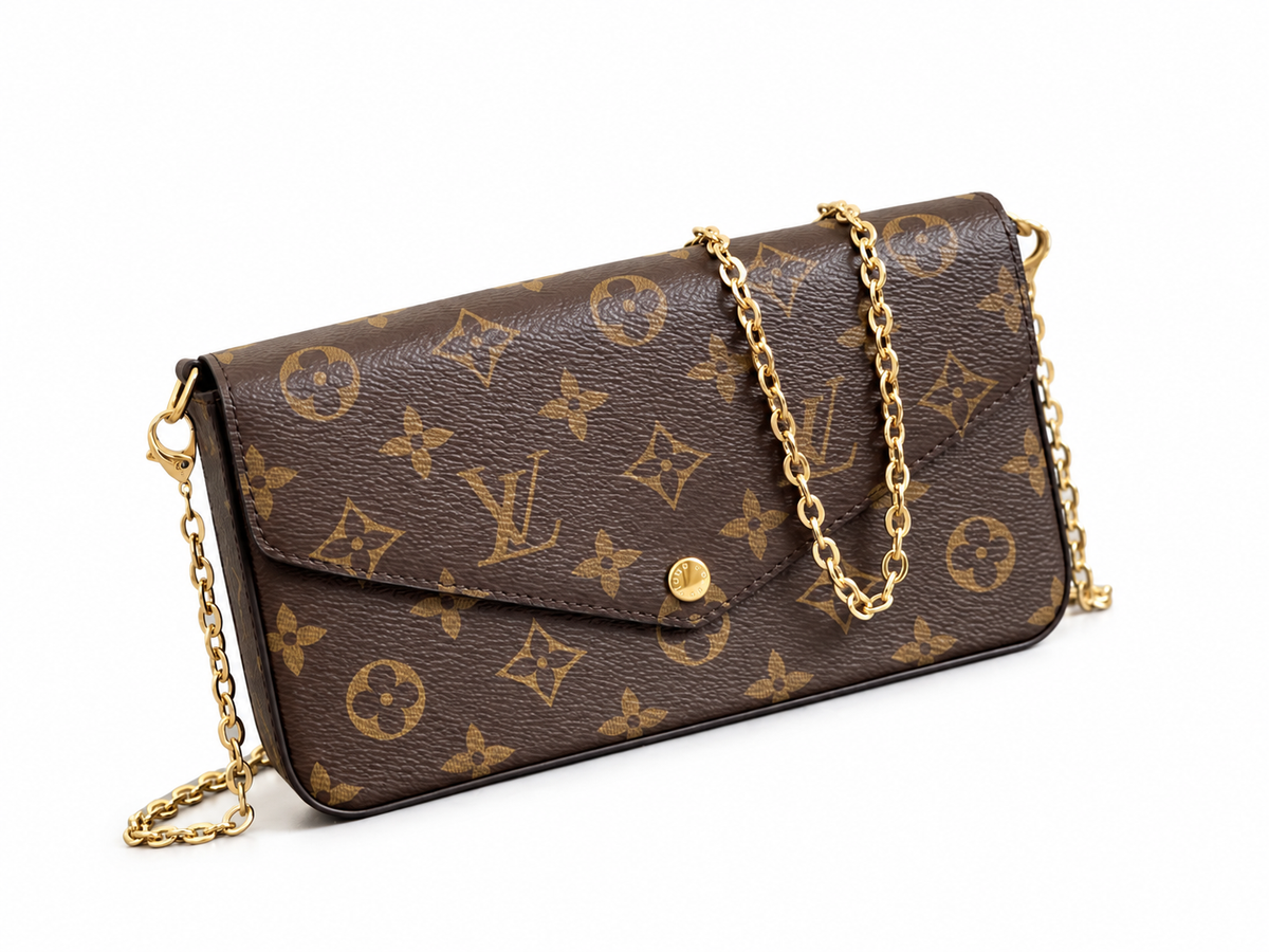 Monogram chain pouch — front three-quarter view, background-edited draft reference