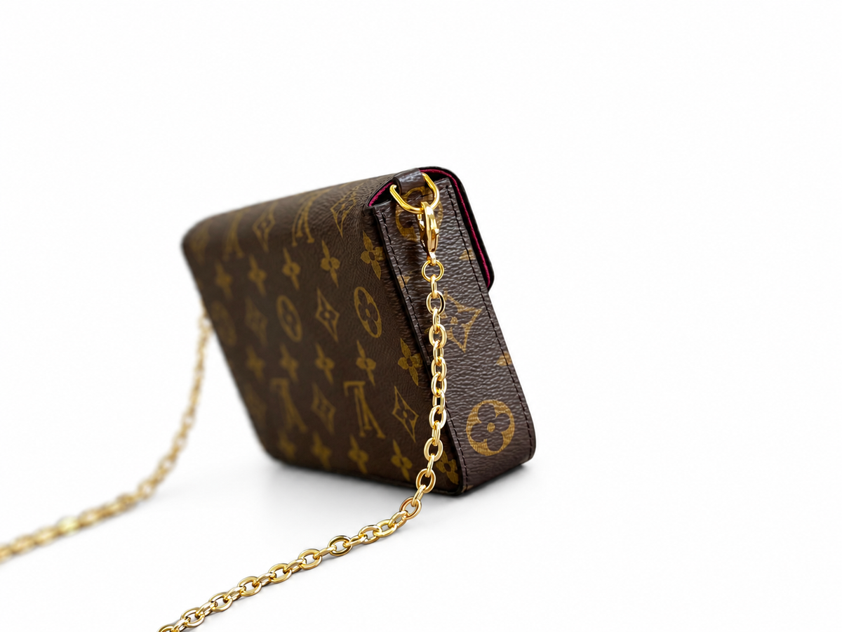 Monogram chain pouch — side view, background-edited draft reference