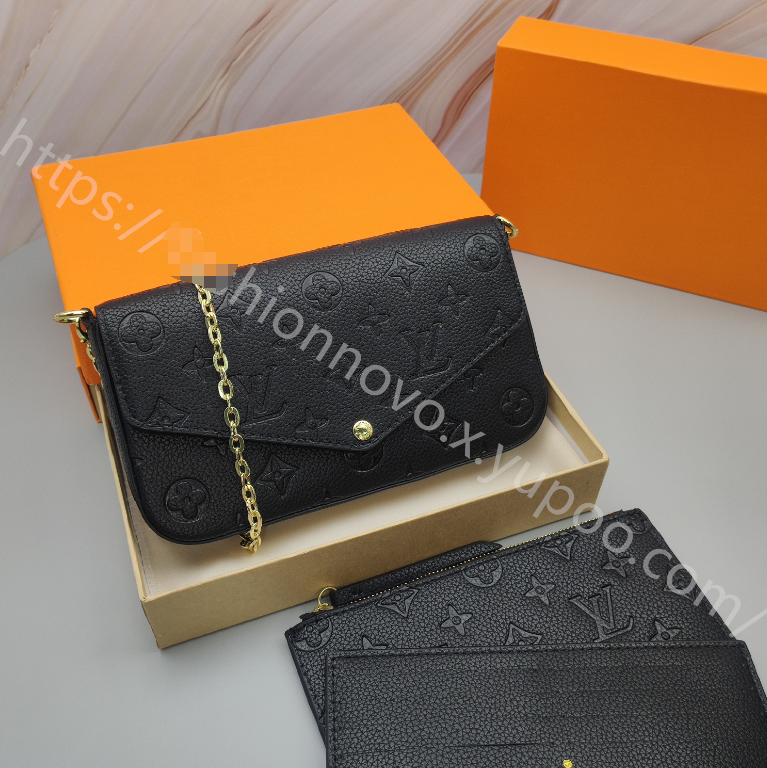 Embossed Monogram Chain Pouch — Black — source reference photo