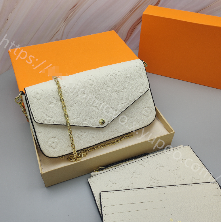Embossed Monogram Chain Pouch — Ivory — source reference photo