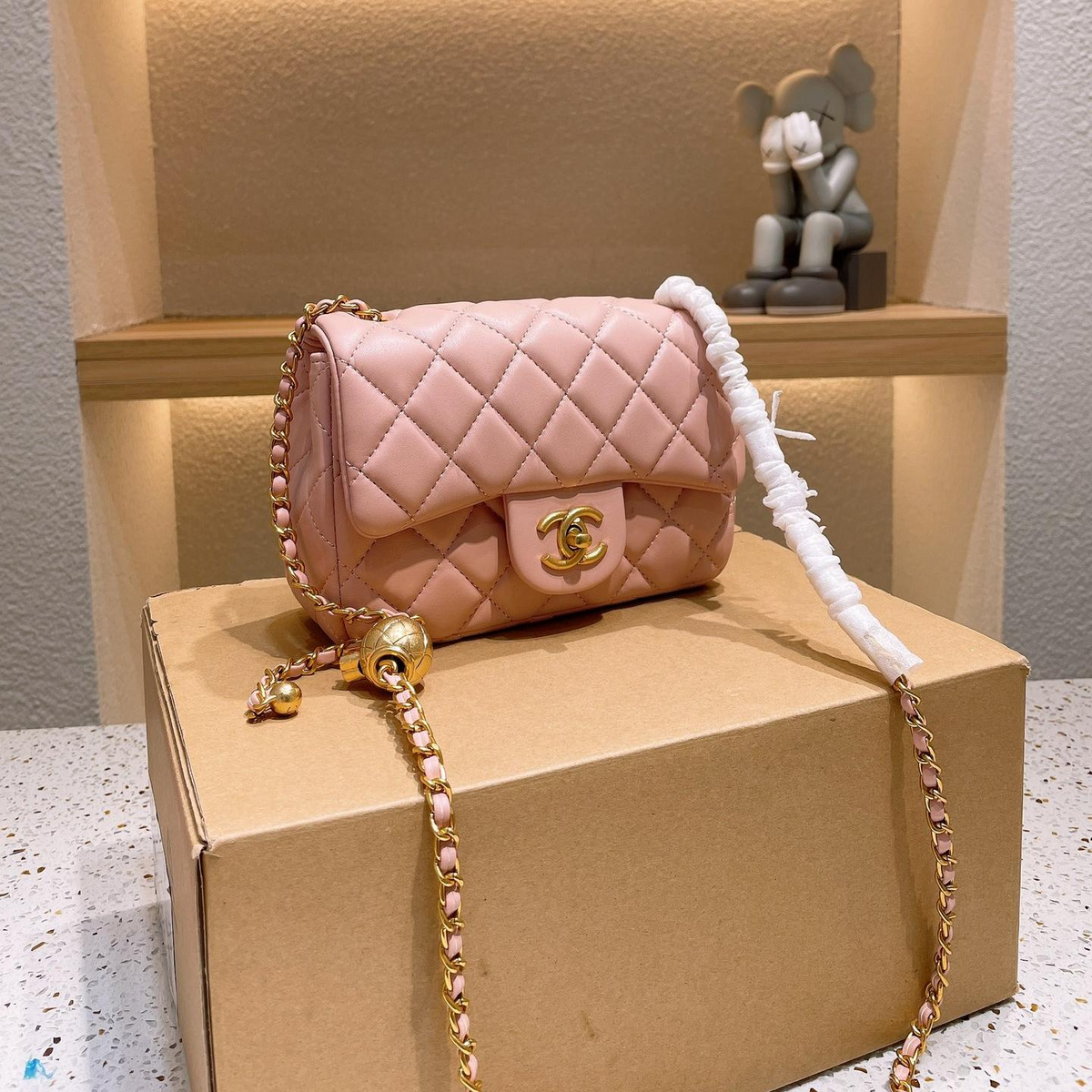Diamond Quilted Chain Flap Shoulder Bag with Ball Detail in Light Pink, supplier source view