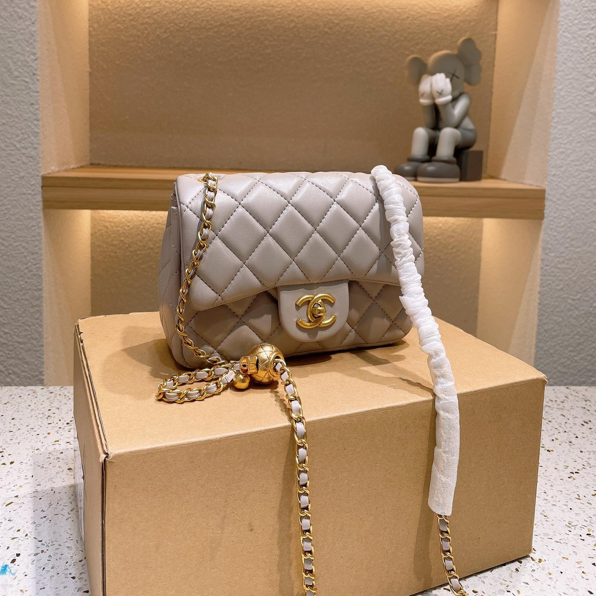 Diamond Quilted Chain Flap Shoulder Bag with Ball Detail in Light Gray, supplier source view