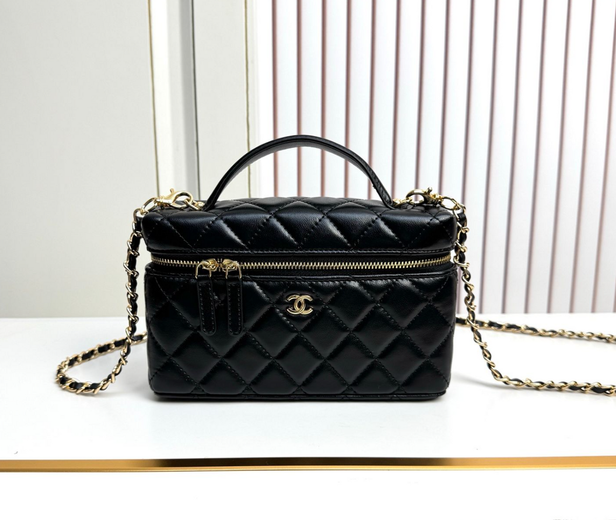 Chanel Diamond Quilted Vanity Bag with Top Handle and Chain – Black, original supplier catalogue view