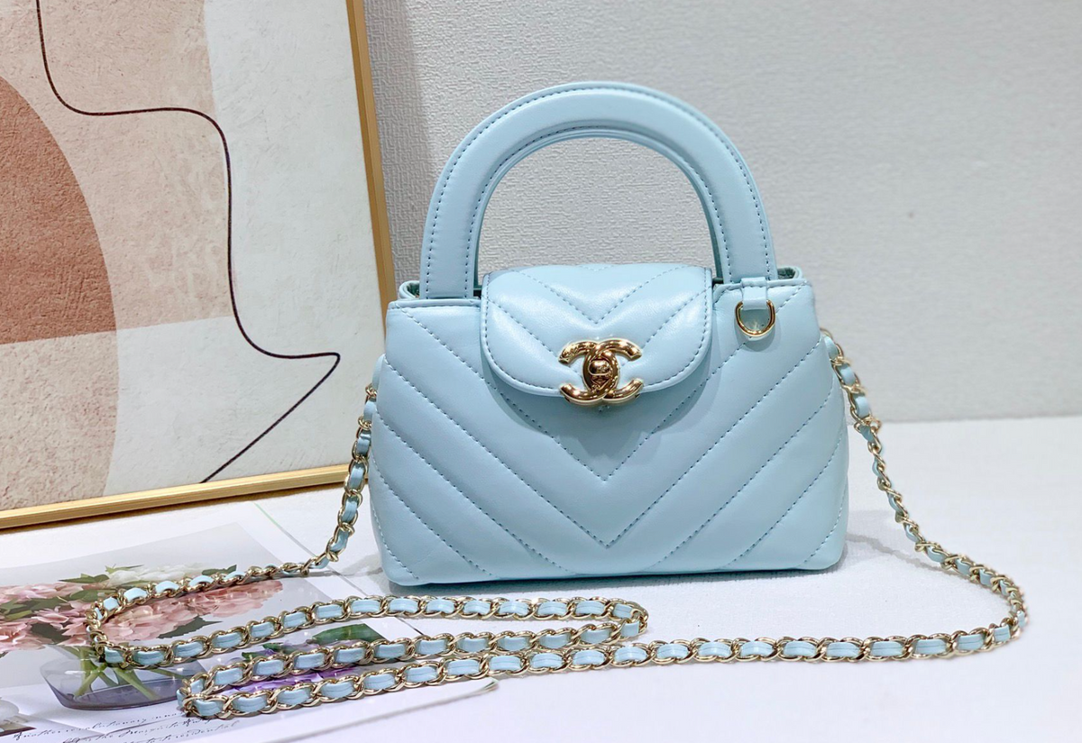 Chanel Chevron Quilted Top Handle Bag – Light Blue, original supplier catalogue view