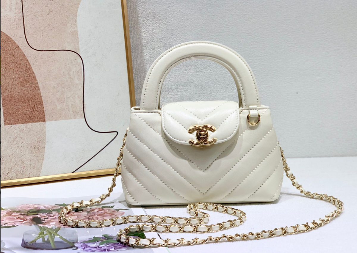 Chanel Chevron Quilted Top Handle Bag – Ivory, original supplier catalogue view