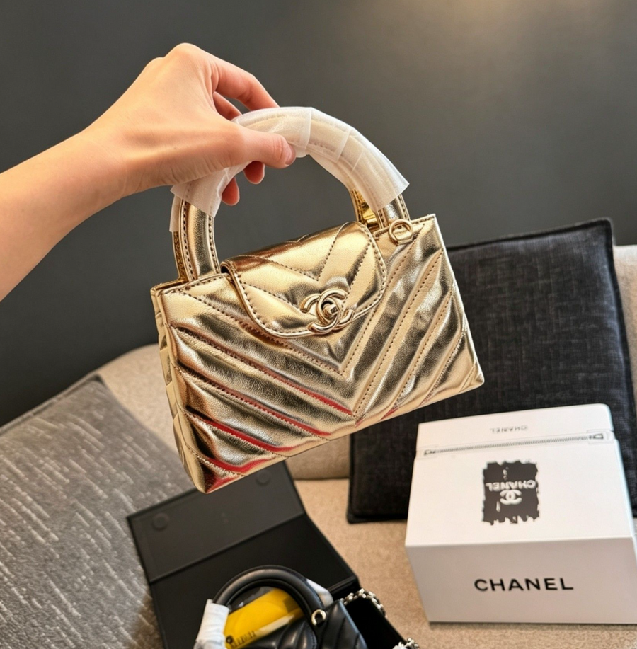 Chanel Chevron Quilted Top Handle Bag – Metallic Gold, original supplier catalogue view