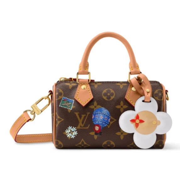Nano Speedy in Monogram Snowy Pearl, front with white Vivienne charm reference view