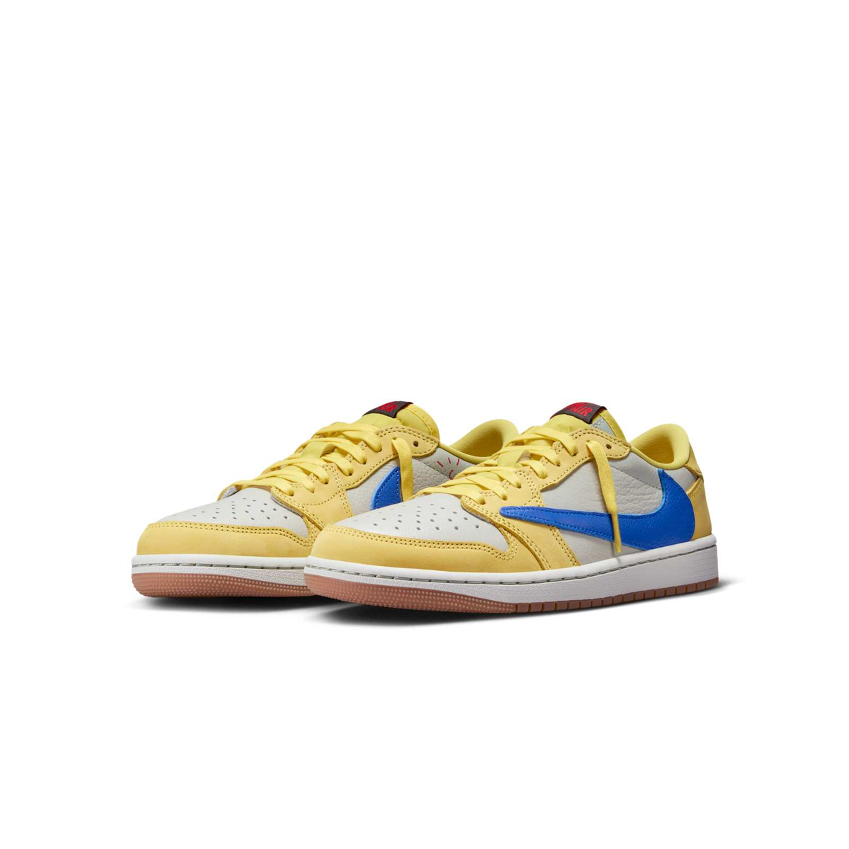 Air Jordan 1 Low OG x Travis Scott — Canary — front three quarter pair